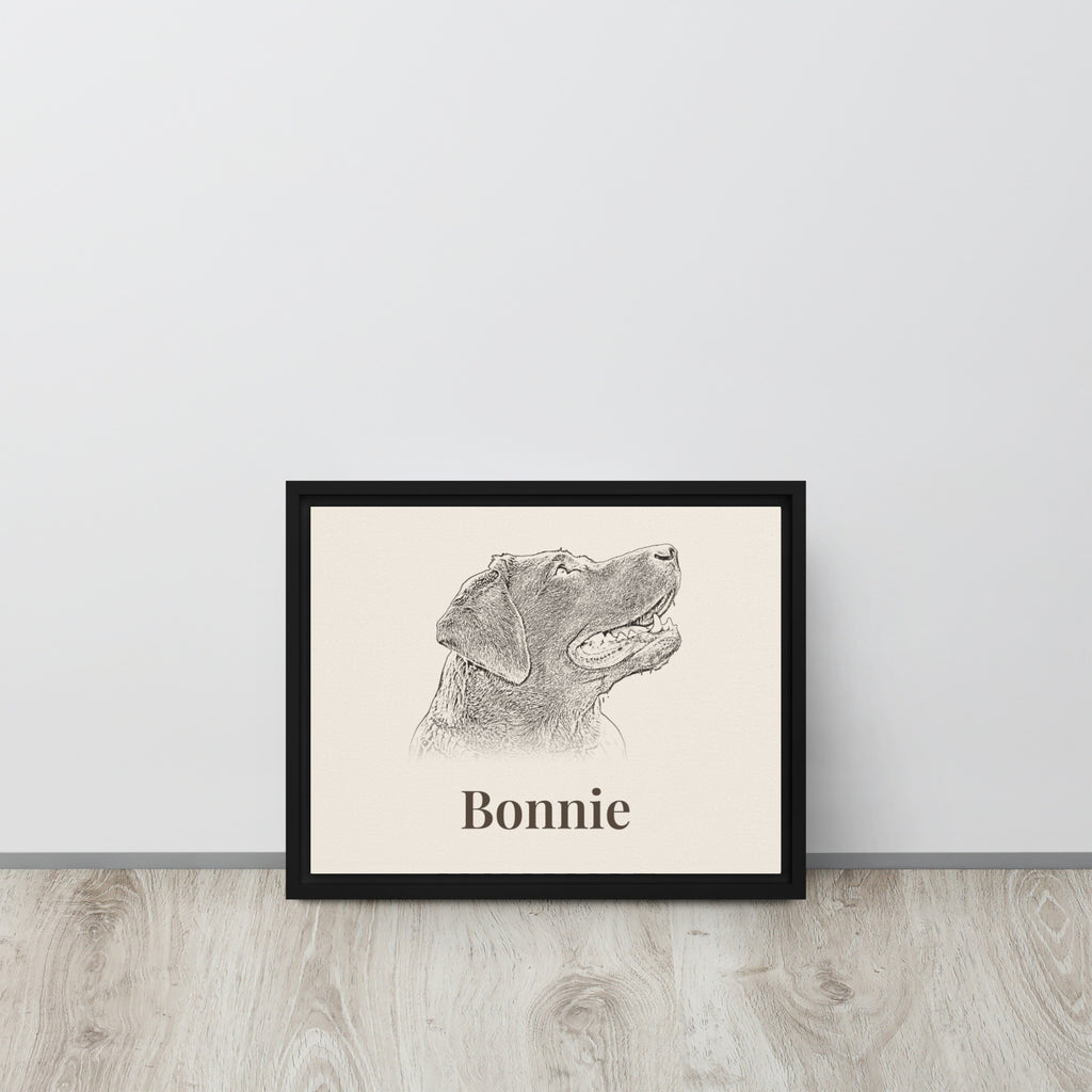 Personalised pencil sketch dog portrait in black framed canvas leaning against a wall
