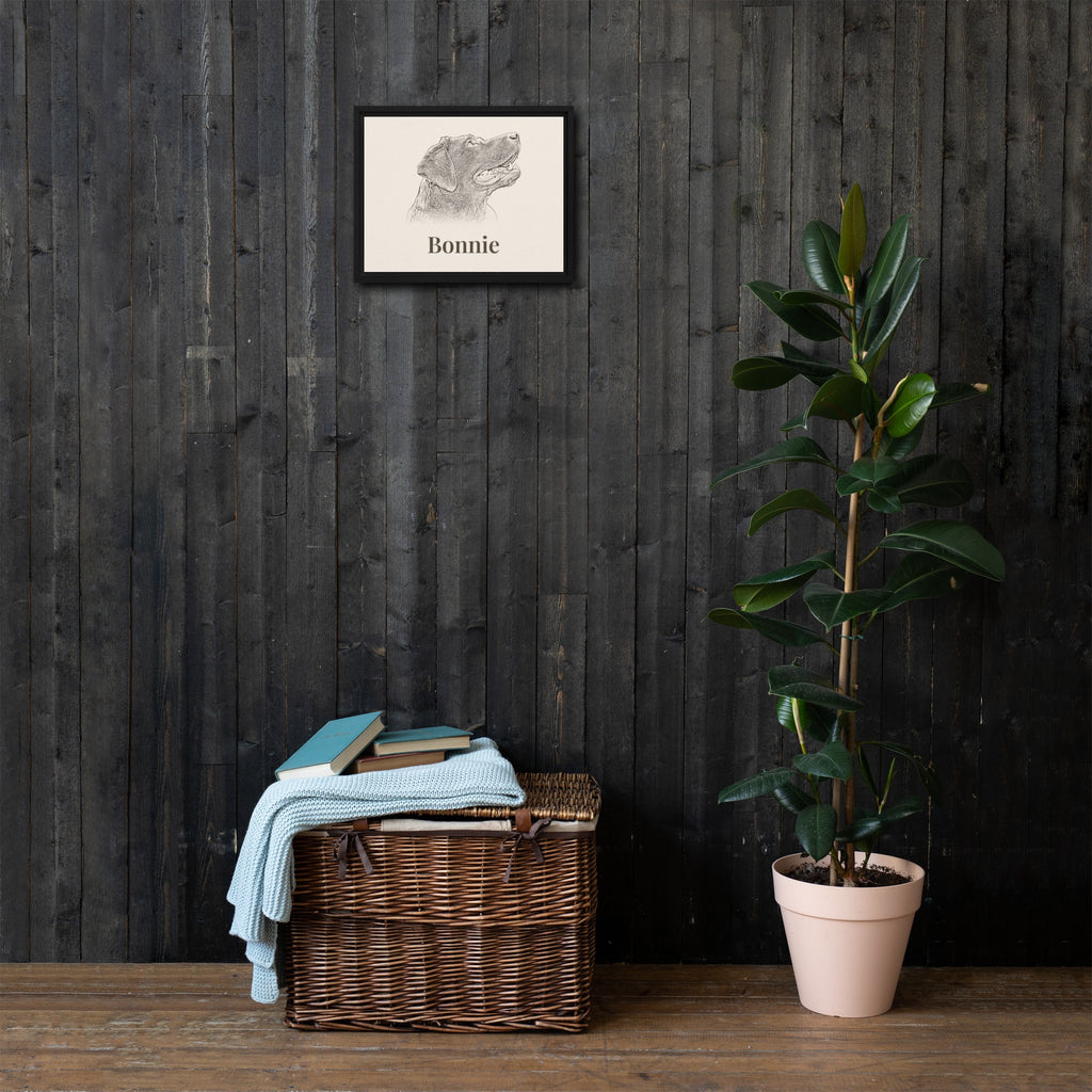 Black framed canvas pet portrait hanging on a dark wood wall