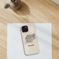 Personalised tough iPhone case with a pencil-style dog portrait, on a desk