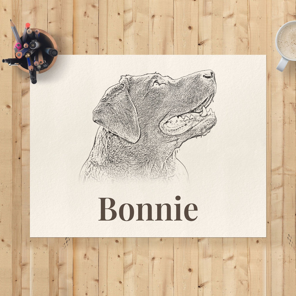Unframed 30×40cm pencil-style dog portrait print with the name Bonnie, flat lay on a pine desk